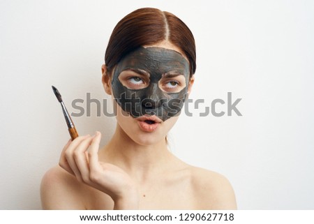 young woman with clay mask skin care spa care healthy
