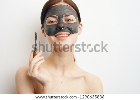 woman put on the face a cosmetic mask made of clay healthy skin