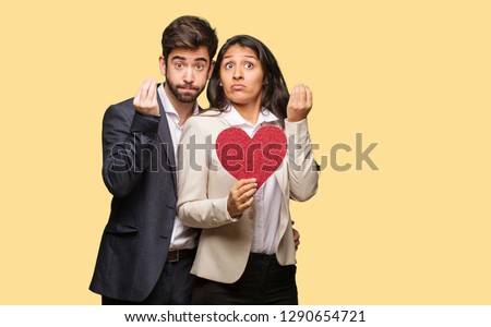 Young couple in valentines day doing a typical italian gesture