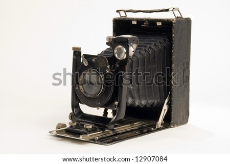 The old photographic chamber with a lens of furs on a white background.