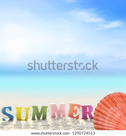 Summer beach. Word summer of color letters on summer beach and seashell on a background of ocean.