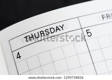 Thursday, days of the week. Black and white macro shot of monthly planner - Image Royalty-Free Stock Photo #1290738826