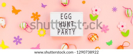 Creative Top view flat lay holiday composition Easter Egg hunt party text on lightbox pink paper background copy space Template Easter day seasonal pattern
