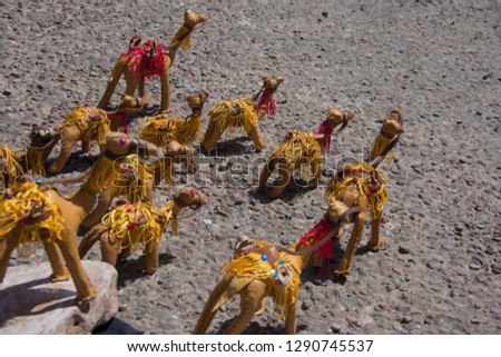 Set of ornament or toy camels with background on asphalt in Morocco
