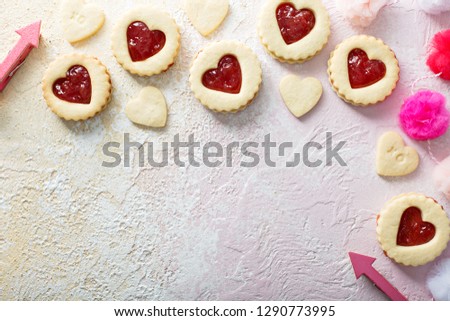 Heart shaped vanilla cookies with jam filling for Valentines day overhead copy space