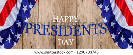 Happy Presidents' Day text on wooden with flag of the United States Border.