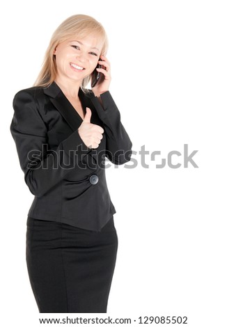 Young businesswoman in black  with smartphone posing over white background.