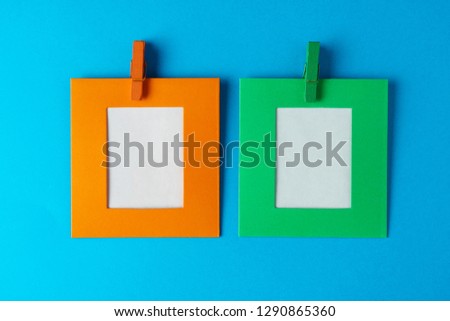 Multicolored paper signs on a blue background, a place for an inscription, top view