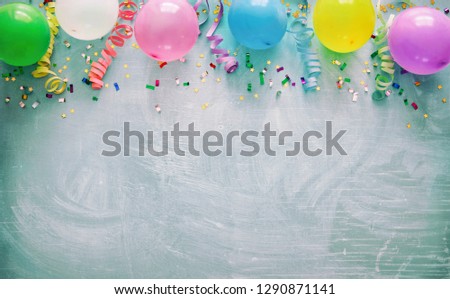 Birthday party decoration with balloons, steamers and confetti