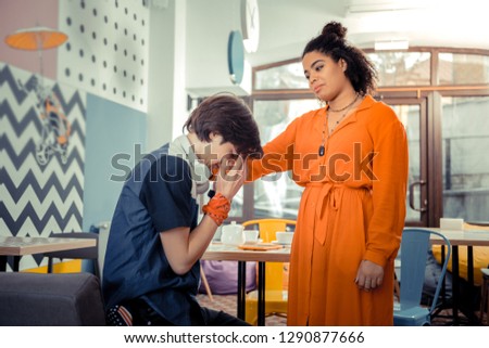 Being close to each other. The teenager girl comforting her male friend in a difficult situation Royalty-Free Stock Photo #1290877666