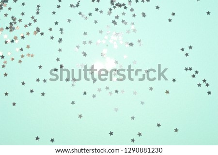 Silver glitter stars on blue background in vintage colors