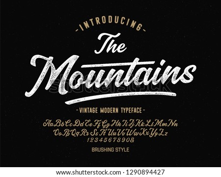 "The Mountains". Vintage Brush Script Modern Alphabet. Retro Typeface. Vector Font Illustration. Vector Royalty-Free Stock Photo #1290894427