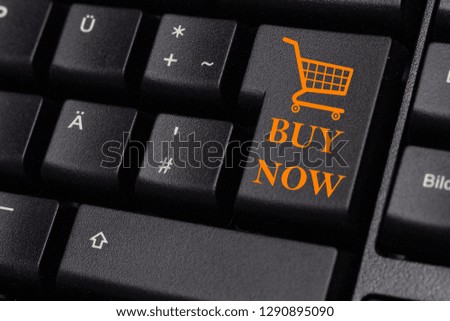 A key that says buy, concept online shopping.