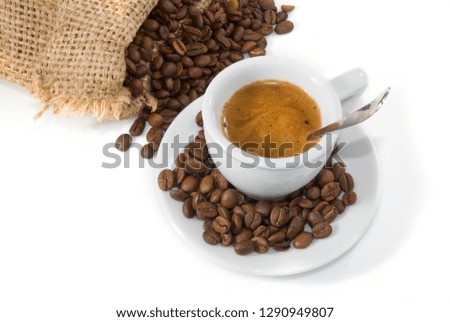 image of cup of coffee and coffee beans closeup