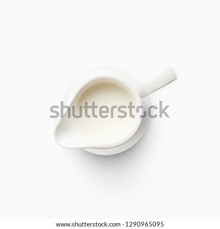 Top view of milk jug isolated on white background. Royalty-Free Stock Photo #1290965095