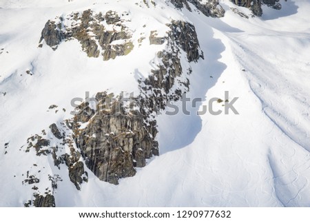 Dolomites rocks in white snowed valley in the Mont Blanc. Alps during winter season whit snow.