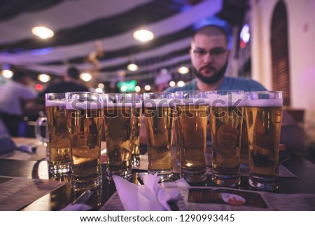Lots of beers on the table. Alcohol addiction, also known as alcoholism. Rehab for alcohol use disorder or drinking habits recovery