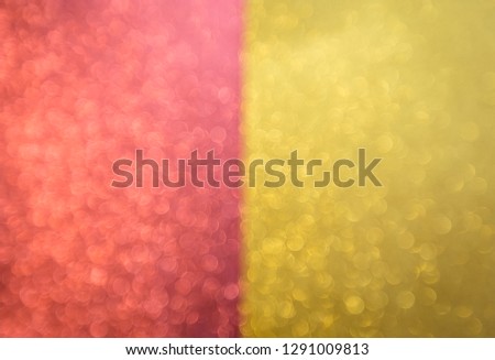 Red and gold bokeh holiday textured glittering and sparkling background