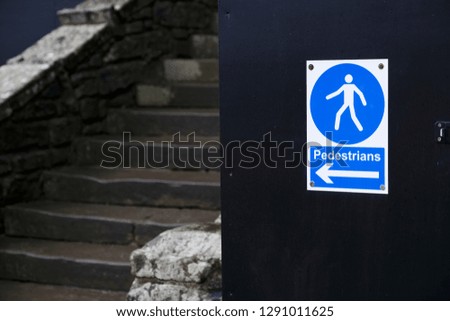Pedestrians direction arrow sign and steps