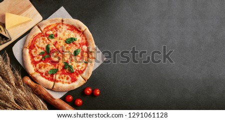 pizza margarita on dark background. Web banner, menu for restaurant or cafe, recipe concept. top view