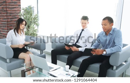 business team studying working papers, sitting in the office