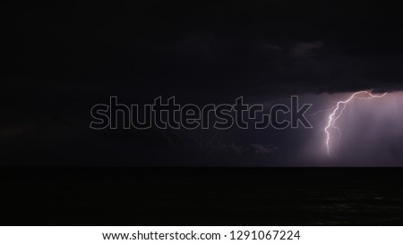 Lightning taken during a violent storm in the sea
