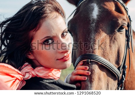 Girl near horse, on horse. Close up.