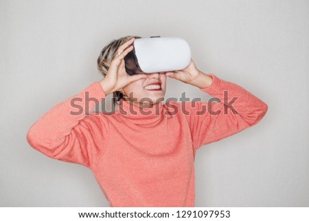 Asian women laugh and enjoy using VR equipment.Focus on VR