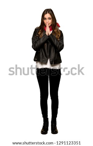 Full-length shot of Young woman with leather jacket keeps palm together. Person asks for something on isolated white background
