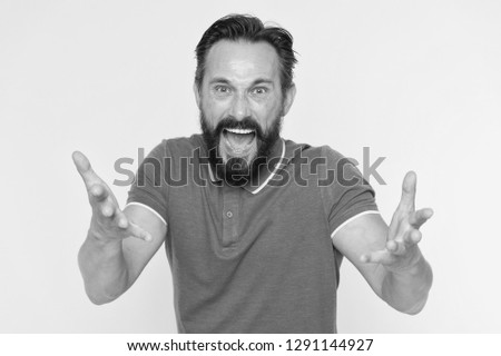 What are you doing. Stop annoying him. Overwhelmed with emotions. Handsome shouting mature man screaming standing against yellow background. Man bearded irritated annoyed can not keep calm anymore.