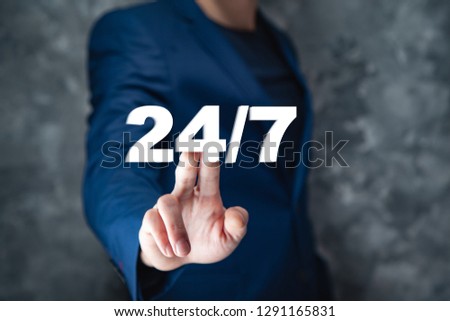 business man hand 24/7 support text in screen