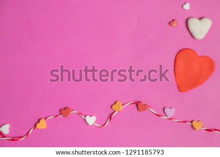 mini hearts and big heart with rope in blank pink background with space for text, Love icon, valentine's day concept