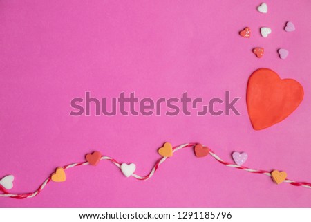 mini hearts and big heart with rope in blank pink background with space for text, Love icon, valentine's day concept