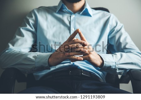 man hand talking in office Royalty-Free Stock Photo #1291193809