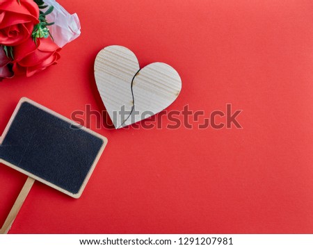Valentines day background with red background and wooden hearts, Place for text, copy space.