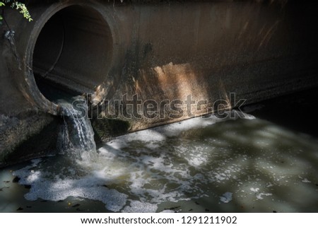 Water  from sewer,Water flowing down a drain.