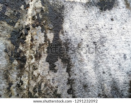 Dirty and Old sandstone wall texture background. Abstract texture of mossy, porous, cracked and weathered sandstone walls. ( Wall texture can be used as a wall frame and wall background )