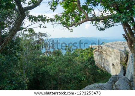 Landscape view of green mountain hill. Frame of stone cliff and tree. Natural park travelling. High attitude.  Environmental and nature adventure. Quiet and remote area. Chaiyabhum. Thailand