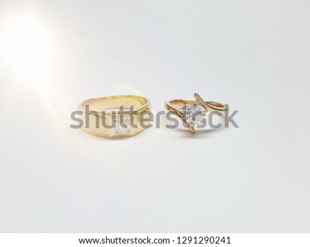 These Engagement or wedding couple rings made from gold with diamonds