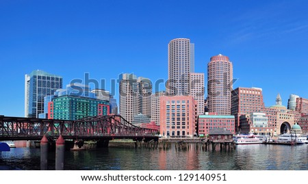 Boston waterfront with skyscrapers and bridge in the morning.