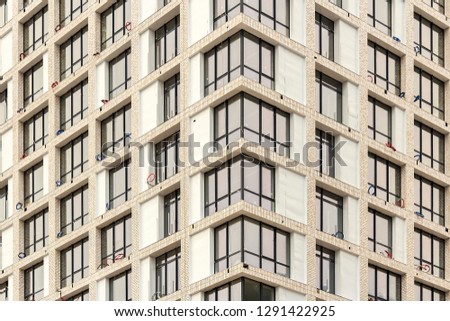 Panoramic windows in office or residential building, view from street. Glazing apartments with glass packs. Insulating glass window panes separated by vacuum, gas filled space to reduce heat transfer