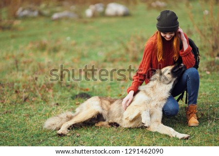 Woman with dog on nature rest           