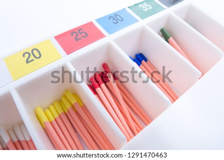 Endodontic instruments. Endodontic pins used to fill tooth canal. Endodontic pins. Royalty-Free Stock Photo #1291470463