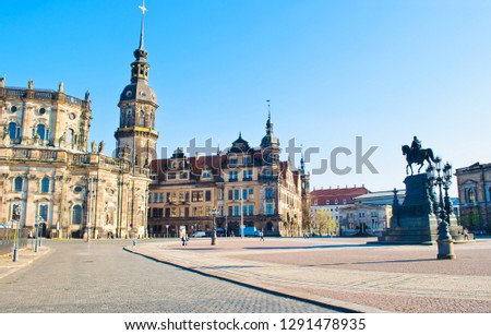Theaterplatz square in Dresden, Germany. Cityscape of amazing architectural  buildings, domes and roofs. Cloudless spring day. View of the ancient city center, Hofkirche, and monument