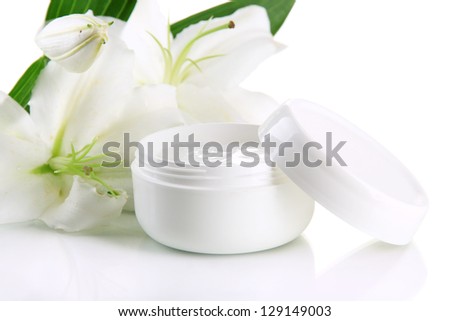 Cosmetic cream and beautiful lily, isolated on white