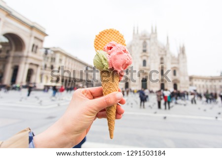 Travel, Italy and holidays concept - Ice cream in front of Milan Cathedral Duomo Royalty-Free Stock Photo #1291503184