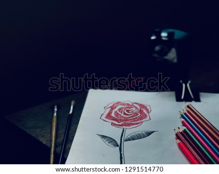 Still life image of Beautiful Rose bouquet flower,hand drawing on white paper,crayon and sharpener on old wood,in dark tone,dimly light.Rural style or vintage tone.Broken heart,valentine's day concept