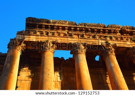 Picture of Baalbeck temple ruins in Heliopolis over clean blue sky background, arabian architecture, Jupiter columns, famous landmark in Lebanon, religious monument, tourism and travel concept