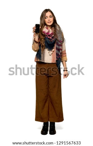 Full-length shot of Young hippie woman with troubled holding broken smartphone on isolated white background