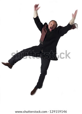Portrait of a exited mature businessman jumping over white background